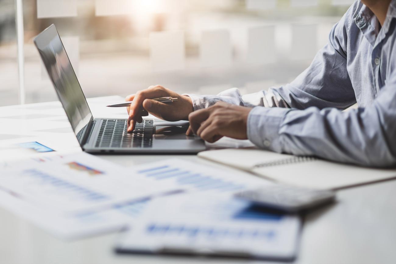 Financial professionals looking at computer